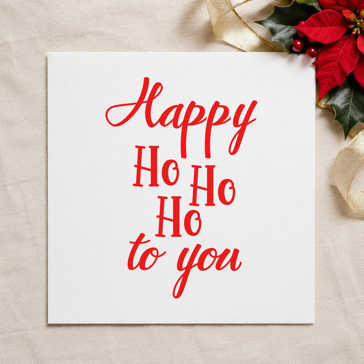 Happy Ho Ho Ho To You rubber stamp shown in red ink, stamped for projects such as spine wrap labels.