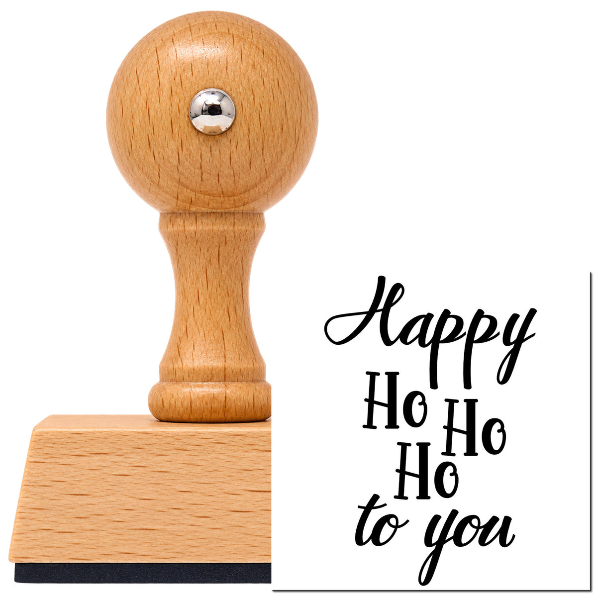 Happy Ho Ho Ho To You Vintage Pro rubber stamp in European beech wood with a round knob handle, shown beside its black imprint.