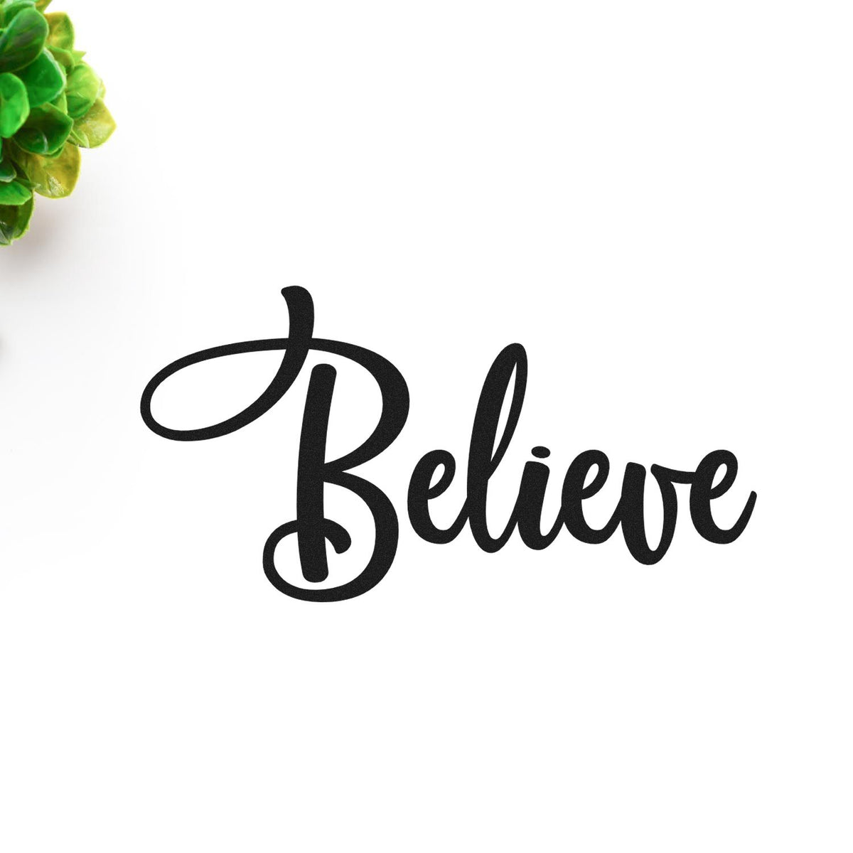 Believe cursive rubber stamp design with elegant black lettering for inspirational crafts and handmade cards.