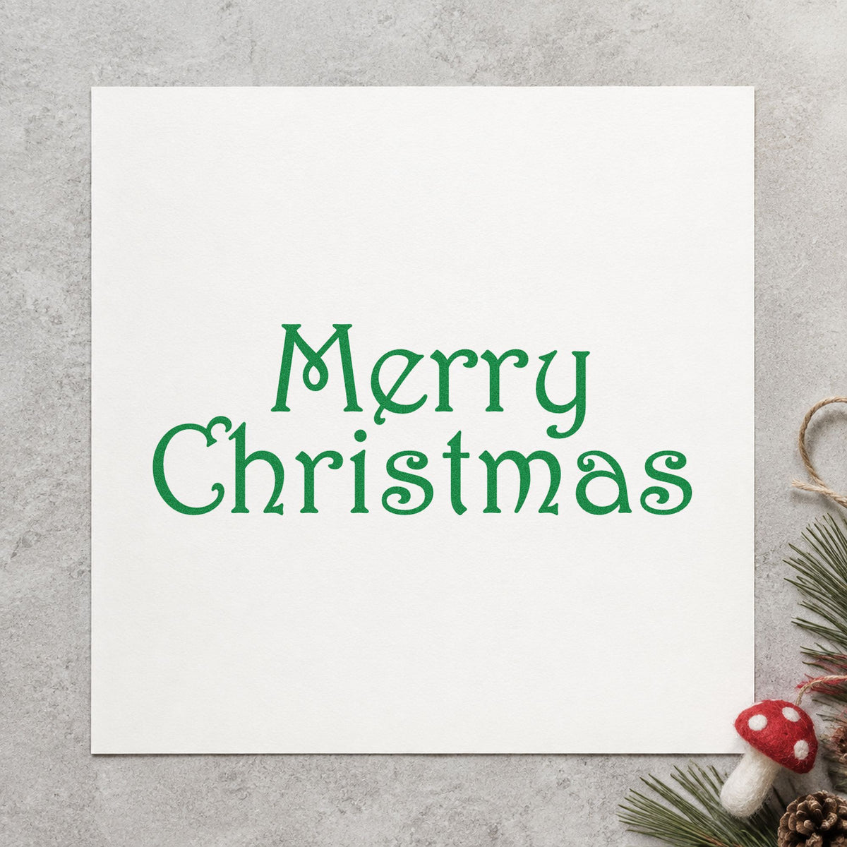 Merry Christmas Thin Serif Lettering Rubber Stamp – Wood Handle in use 3