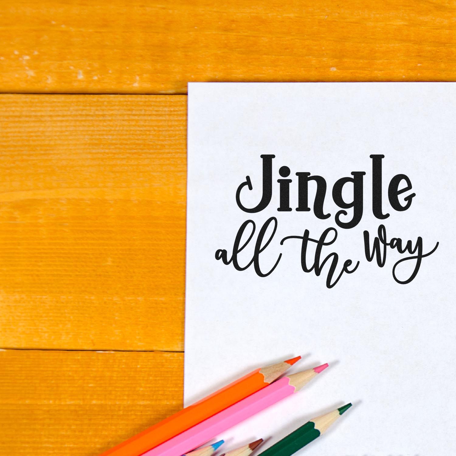 Jingle all the Way holiday rubber stamp on paper with colored pencils for Christmas card making and craft projects.
