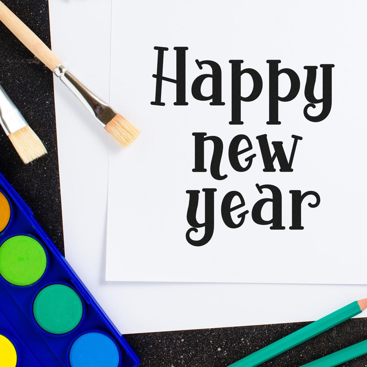 Happy New Year rubber stamp design with paintbrushes and watercolor palette for New Year card making
