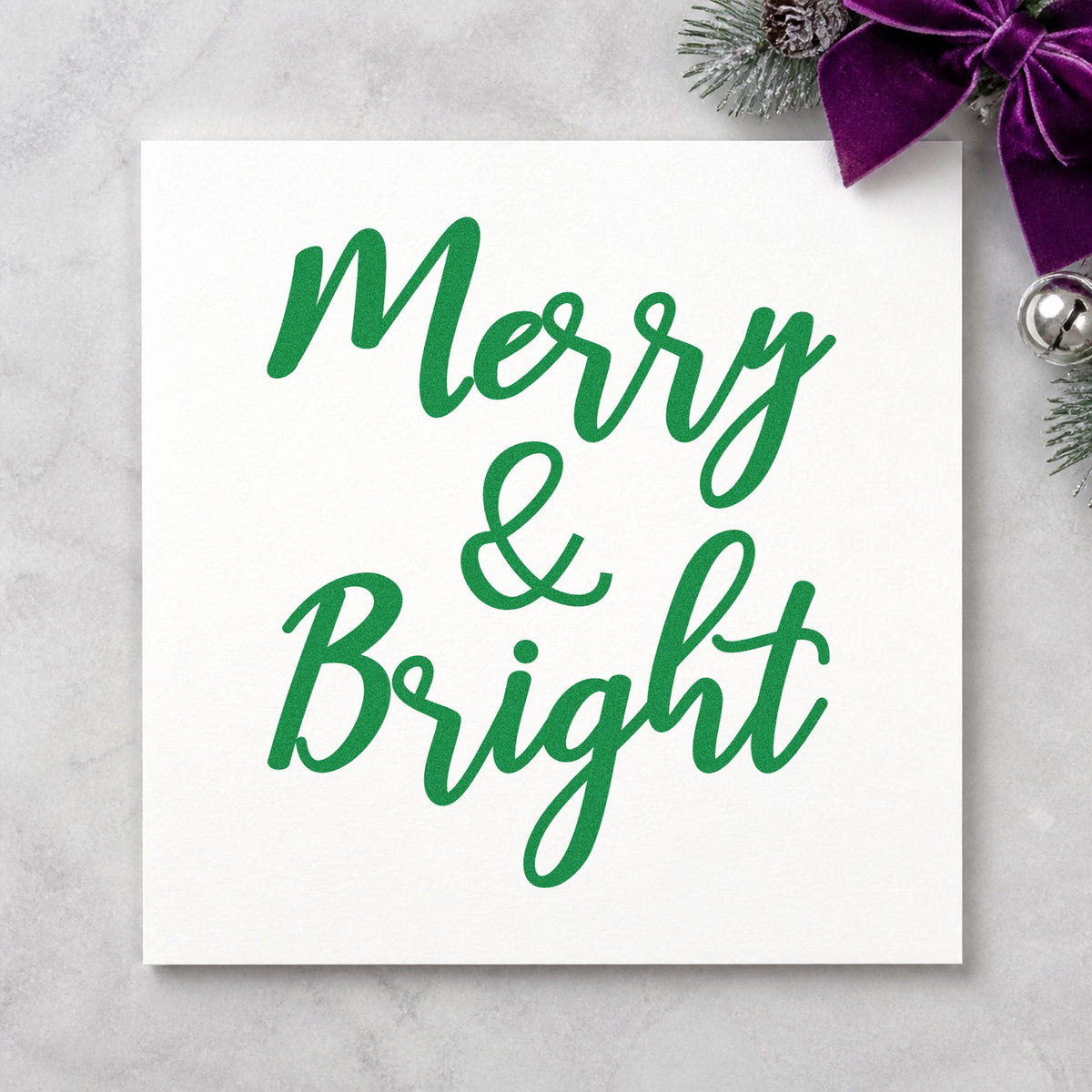 Merry And Bright Brush Script craft stamp imprint in green ink on a handmade project, one idea being sandwich board tags.