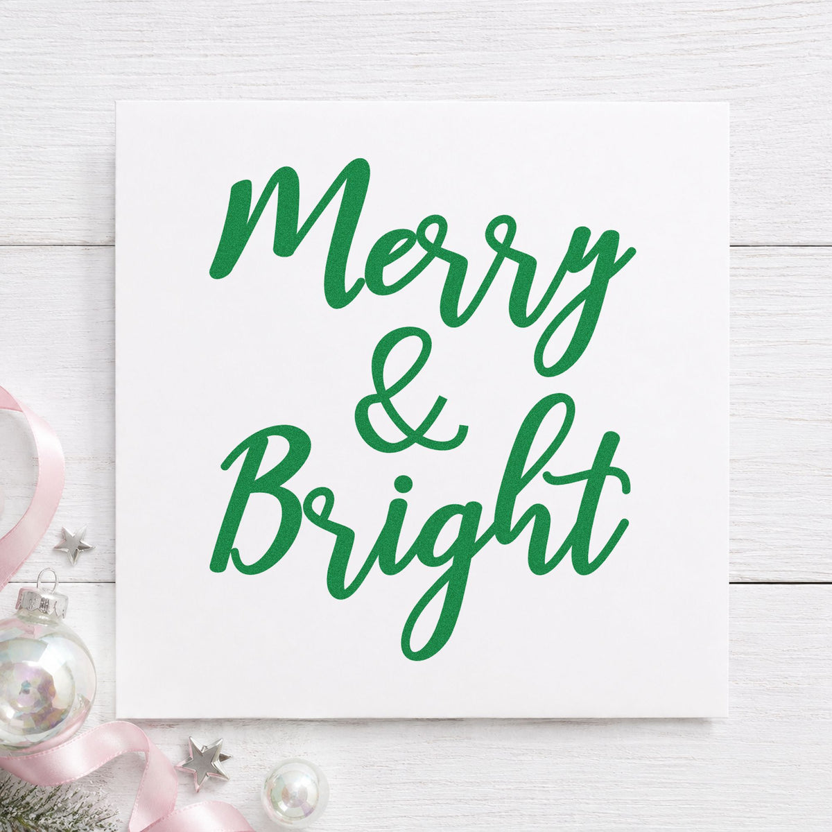 Merry And Bright Brush Script craft stamp imprinted in green ink on paper, a design suited to framed chalk panel.