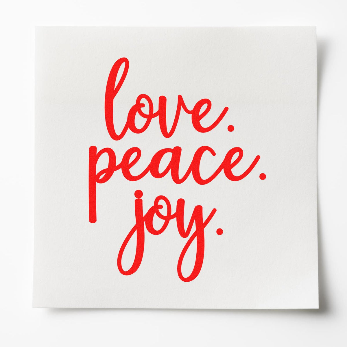 Love peace joy rubber stamp design in bold red script for cards, crafts, and festive packaging.