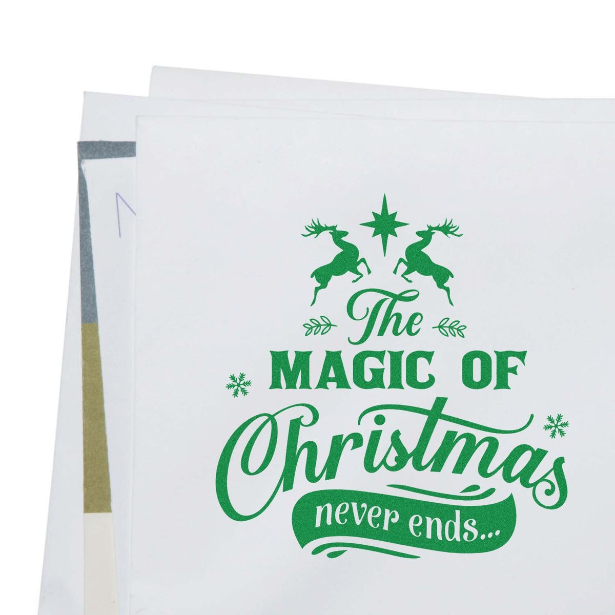 Custom Christmas rubber stamp for holiday cards featuring reindeer and The Magic of Christmas never ends greeting.