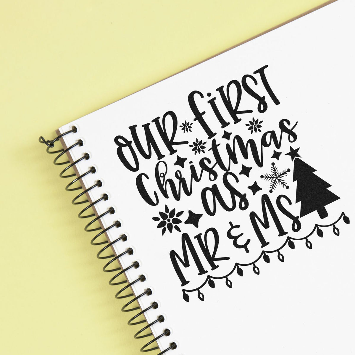 Premium Wooden First Christmas Mr And Mrs Lights Tree Motif Stamp - Vintage Pro imprint stamped in black ink. "Our First Christmas as Mr & Mrs" is decorated with snowflakes, hearts, a tree, and hanging lights.