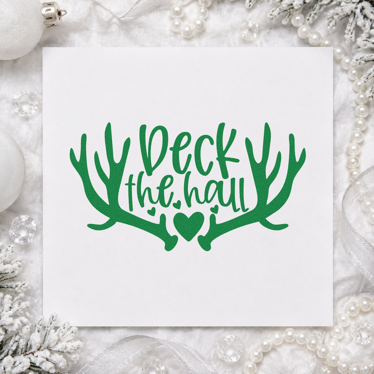Deck The Hall Antlers craft stamp imprint in green ink on a handmade project, one idea being party direction cards.