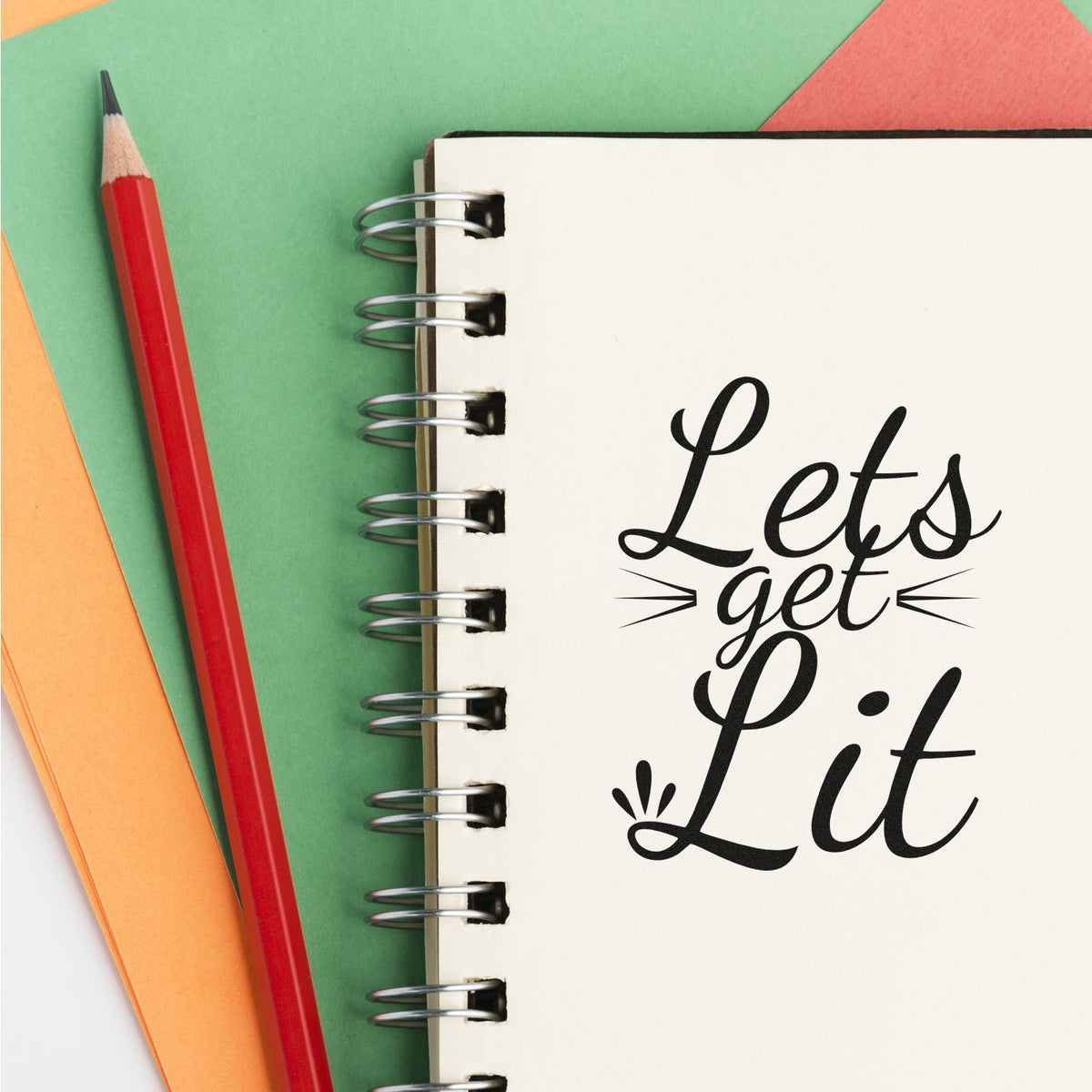 Lets Get Lit rubber stamp design on notebook page, ideal for crafting, journaling, and party invitations.