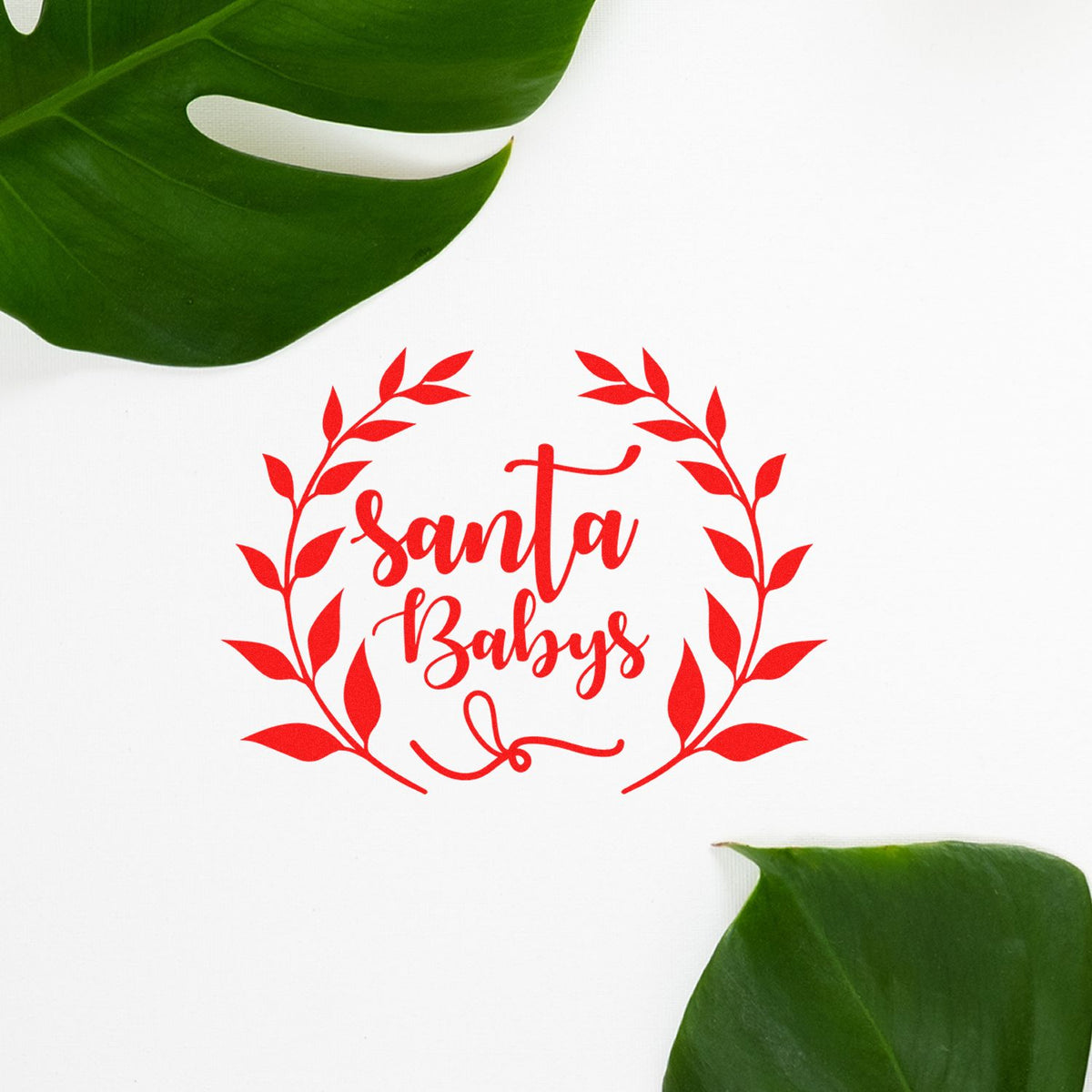 Santa Babys Leaf Wreath rubber stamp shown in red ink, stamped for projects such as torch song album.