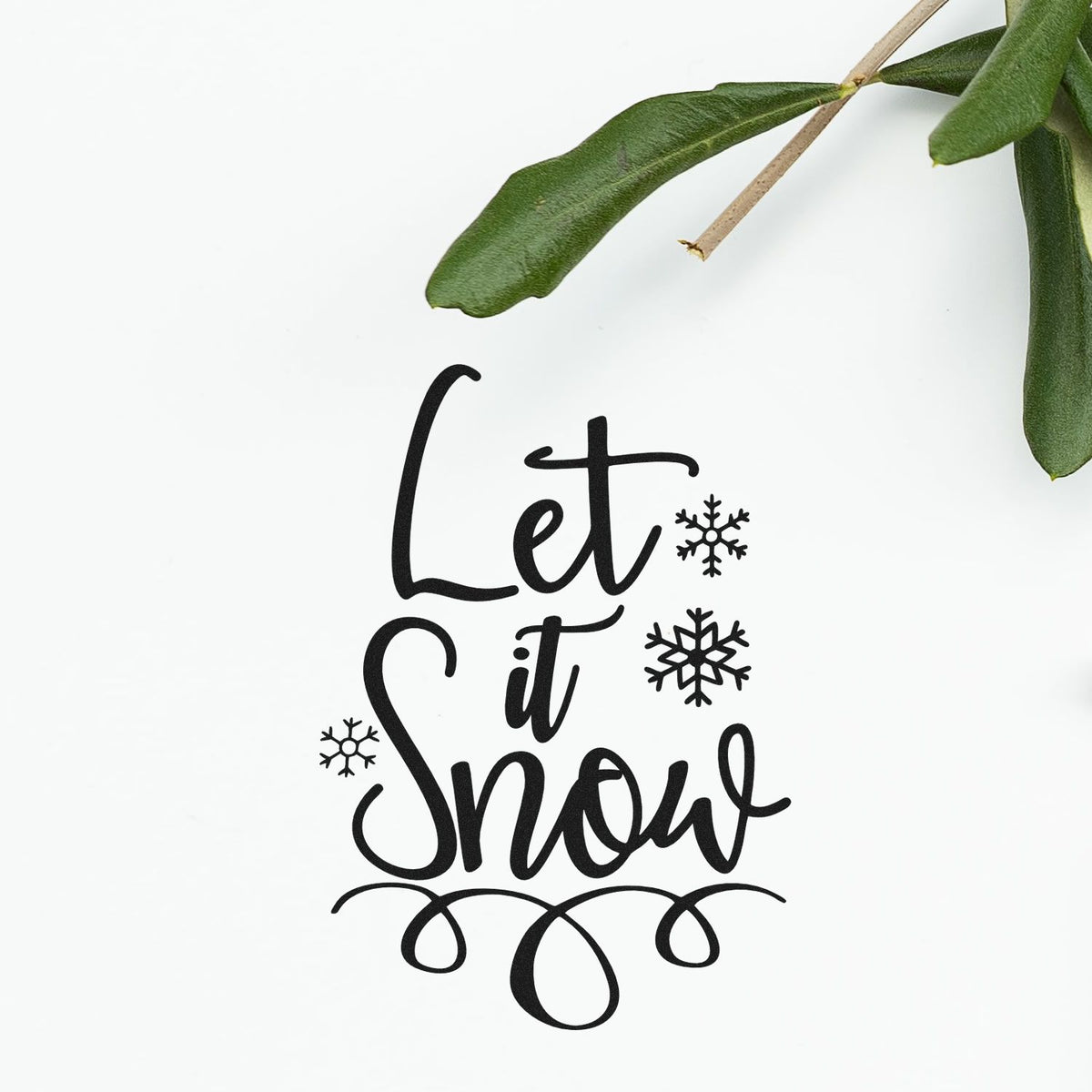 Let It Snow winter Christmas rubber stamp design with hand-lettered script and snowflake accents.