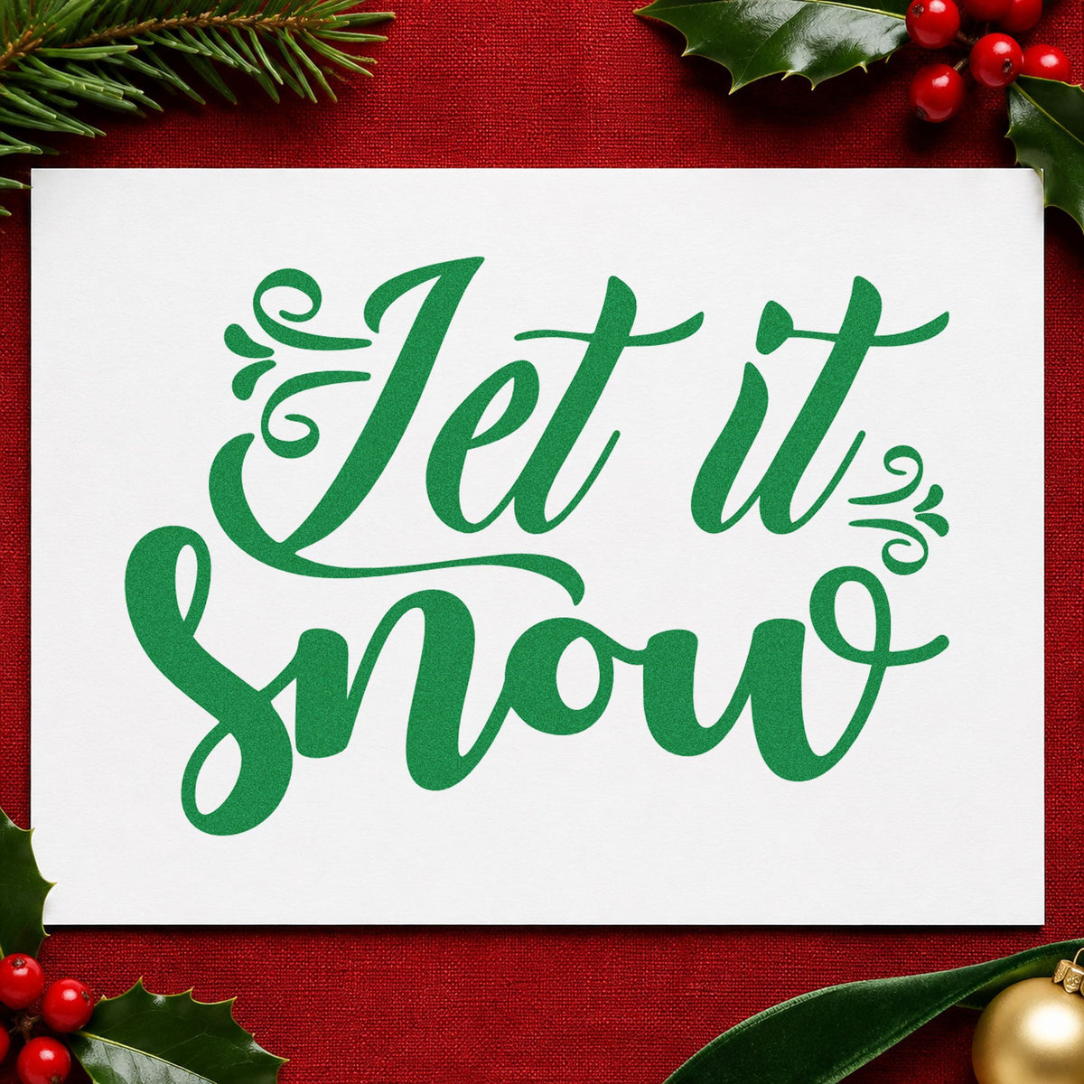 Let It Snow Ornate Script craft stamp imprint in green ink on a handmade project, one idea being mitten basket tags.