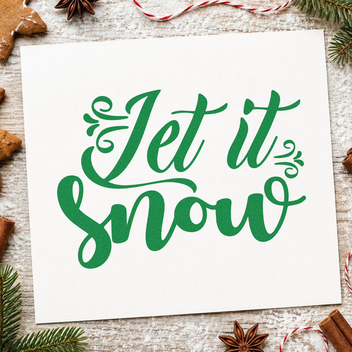 Let It Snow Ornate Script craft stamp imprint in green ink on a handmade project, one idea being cocoa bar placards.