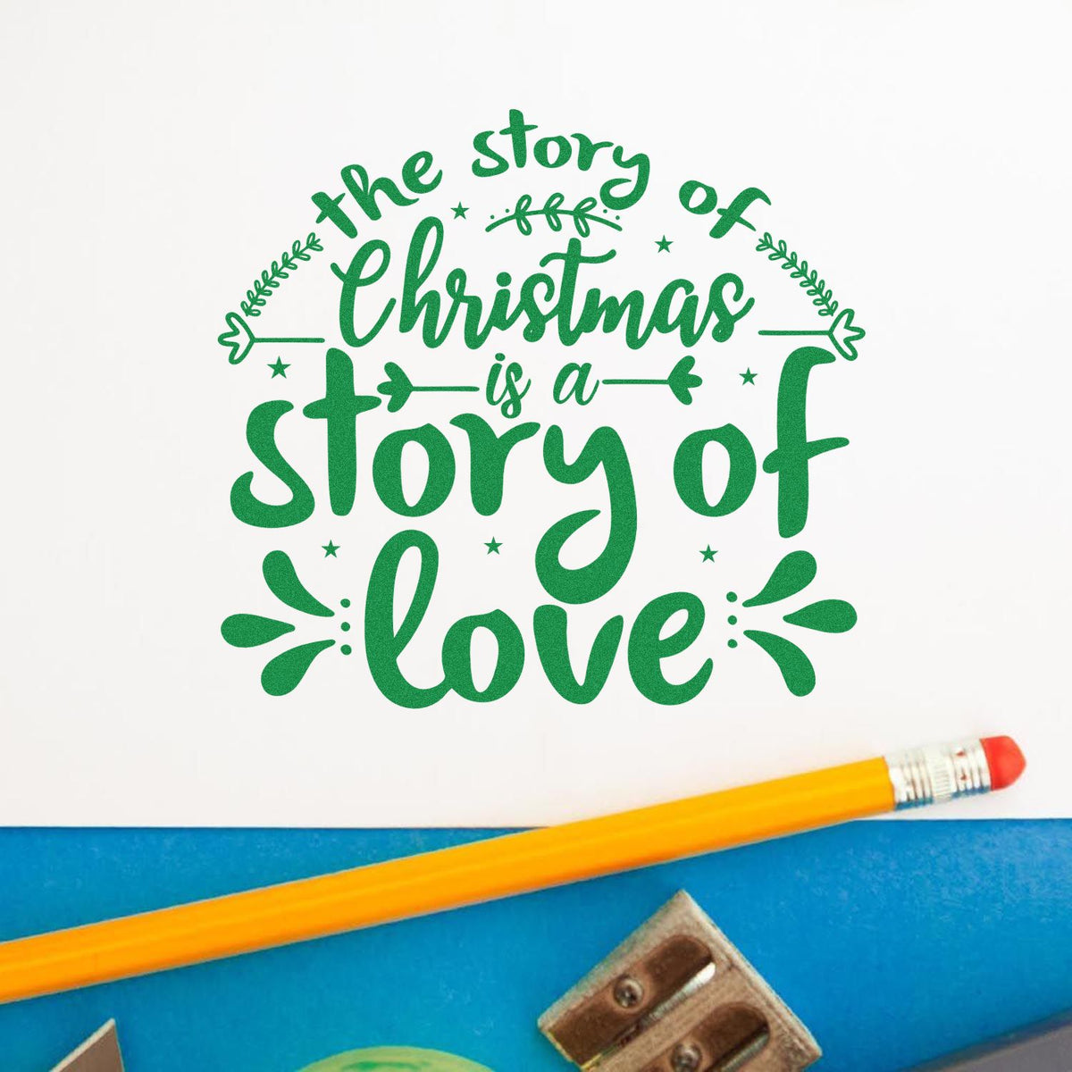 Christmas rubber stamp design with the story of Christmas is a story of love in decorative green lettering for holiday crafts