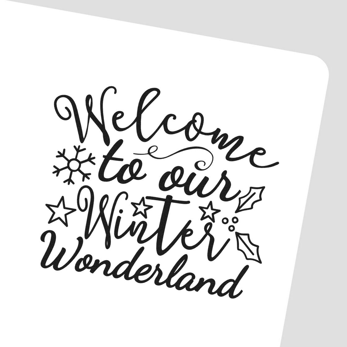 Winter Wonderland welcome rubber stamp design with festive script, snowflakes, stars and holiday holly accents.