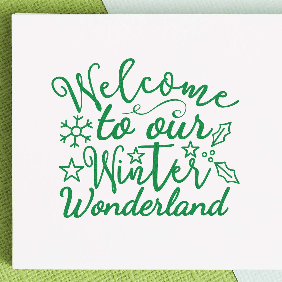 Winter welcome rubber stamp design with Welcome to our Winter Wonderland text, snowflakes, stars, and holly accents.