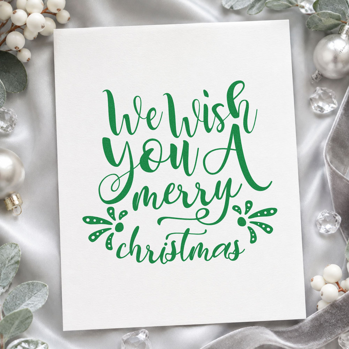 We Wish Merry Christmas craft stamp imprint in green ink on a handmade project, one idea being reply card inserts.