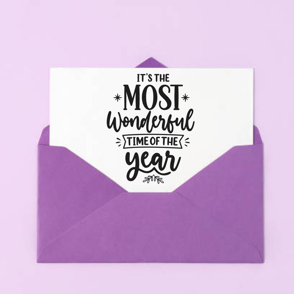 It's The Most Wonderful Time Of The Year Star Accents PSI Pre-Inked Stamp imprint stamped in black ink. “It's the Most Wonderful Time of the Year” includes a boxed middle phrase and small decorative stars.