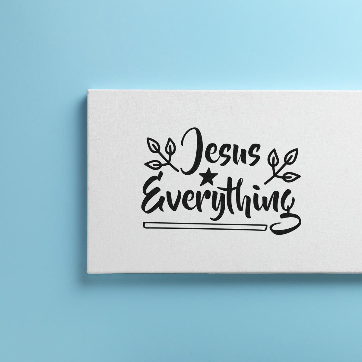 Jesus Is Everything Christian rubber stamp impression with leaf accents on white canvas mockup.