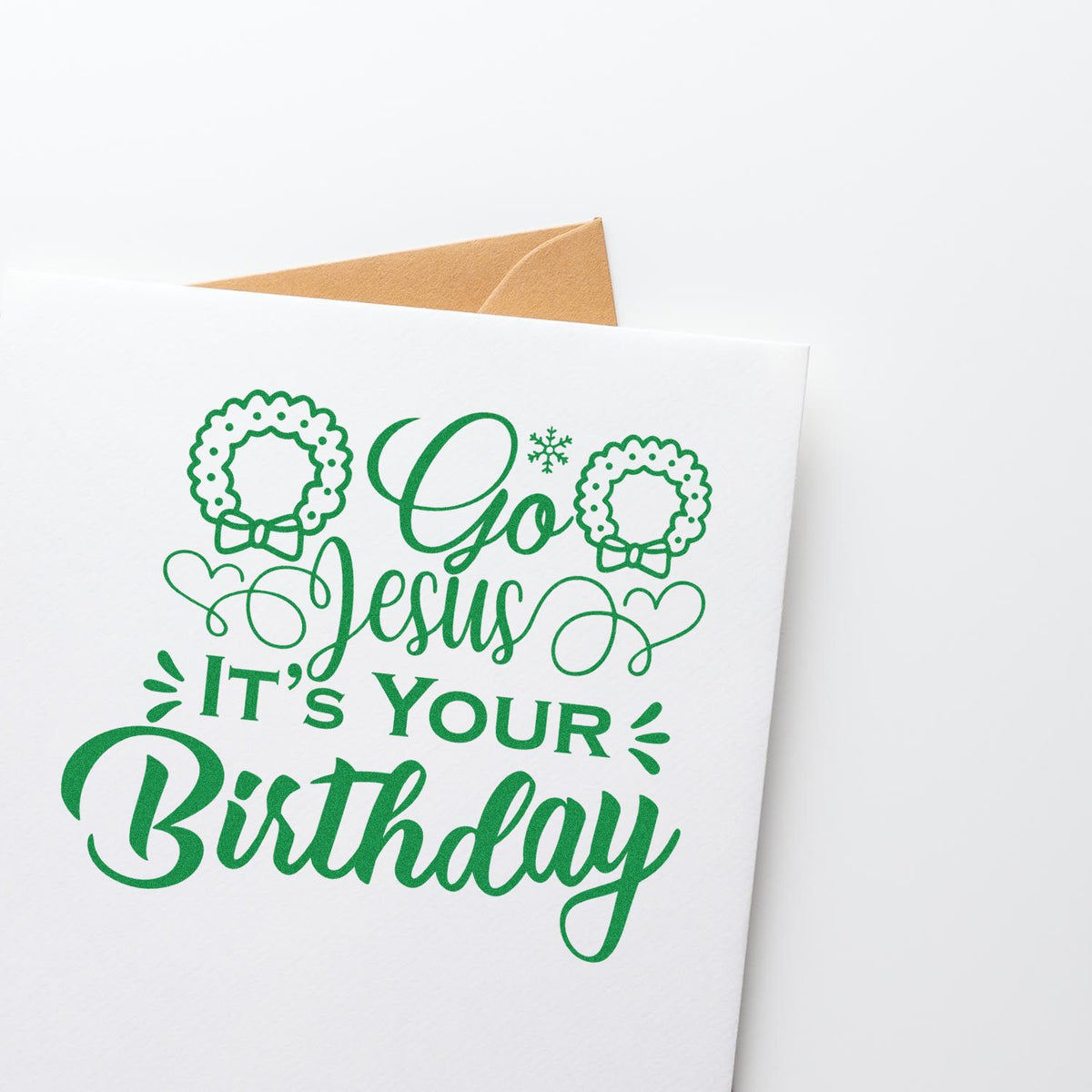 Go Jesus Its Your Birthday rubber stamp design on a greeting card, featuring green wreaths, hearts, and an envelope.