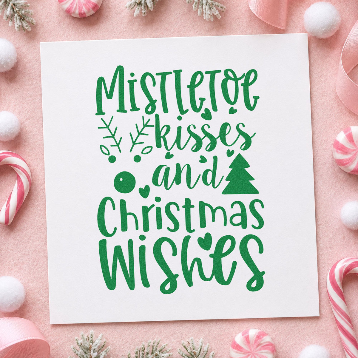 Mistletoe Kisses Christmas Wishes craft stamp imprint in green ink on a handmade project, one idea being save the date cards.