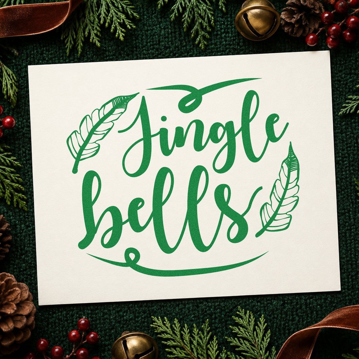 Jingle Bells Feather Flourishes craft stamp imprinted in green ink on paper, a design suited to framed rattan mat.