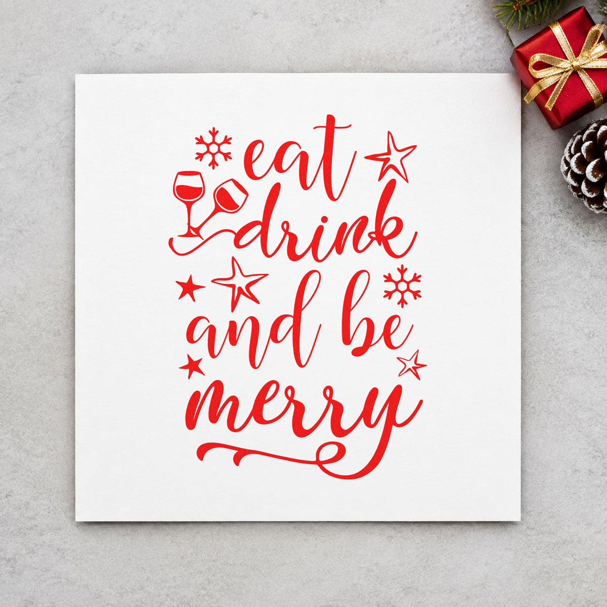 Eat Drink And Be Merry rubber stamp shown in red ink, stamped for projects such as serving dish labels.