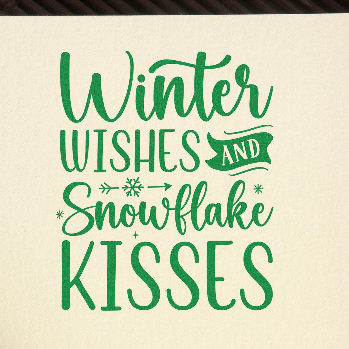 Winter Wishes Snowflake Kisses rubber stamp shown in green ink, stamped for projects such as verse album page.