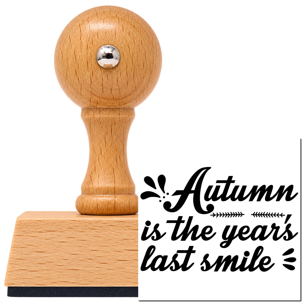 Autumn Is The Year's Last Smile Vintage Pro rubber stamp in European beech wood with a round knob handle, shown beside its black imprint.