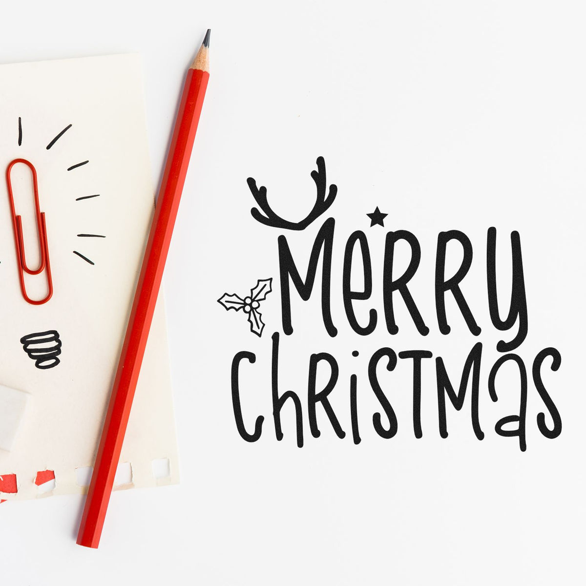 Merry Christmas rubber stamp design with holly and antler accents for festive holiday cards and paper crafts.