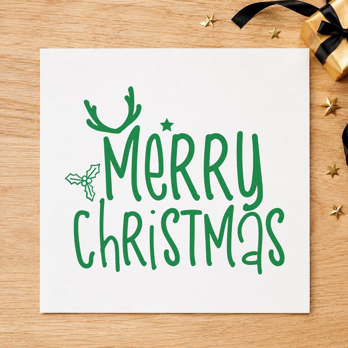 Merry Christmas Antlers Holly craft stamp imprint in green ink on a handmade project, one idea being quick gift tags.