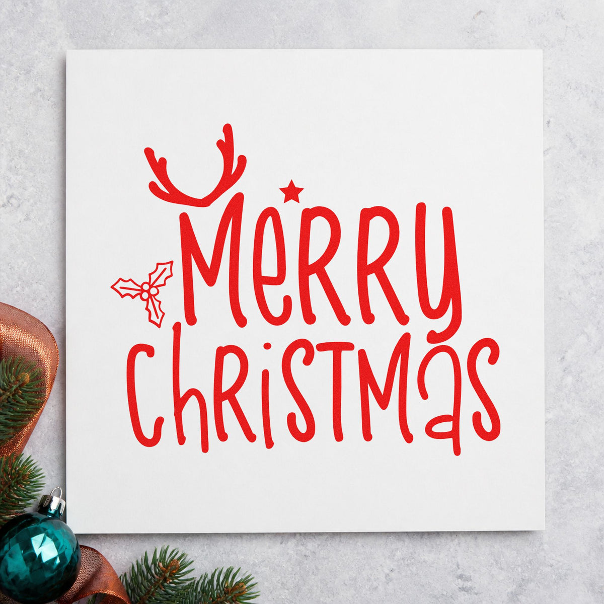 Merry Christmas Antlers Holly rubber stamp shown in red ink, stamped for projects such as tin lid labels.