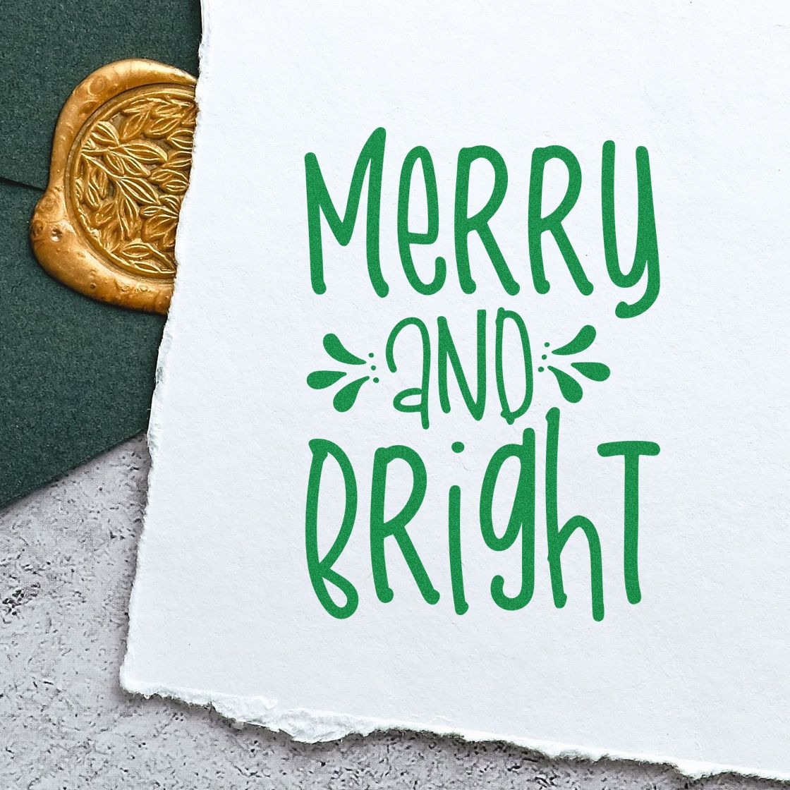 Merry and Bright holiday rubber stamp design in festive green, perfect for Christmas cards, gift tags, and crafts.
