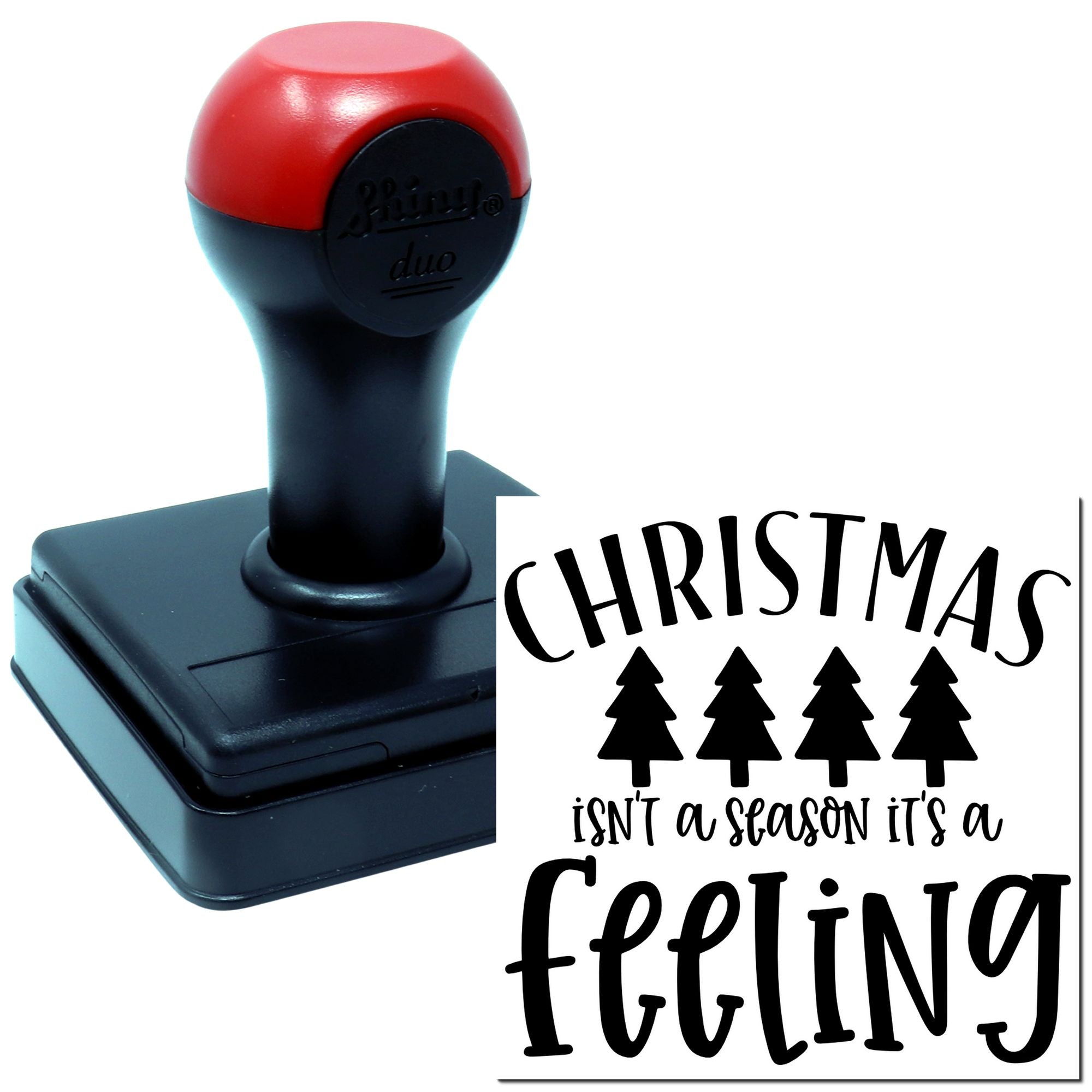 Self-inking holiday rubber stamp with Christmas quote, Christmas isnt a season, its a feeling, and pine trees.