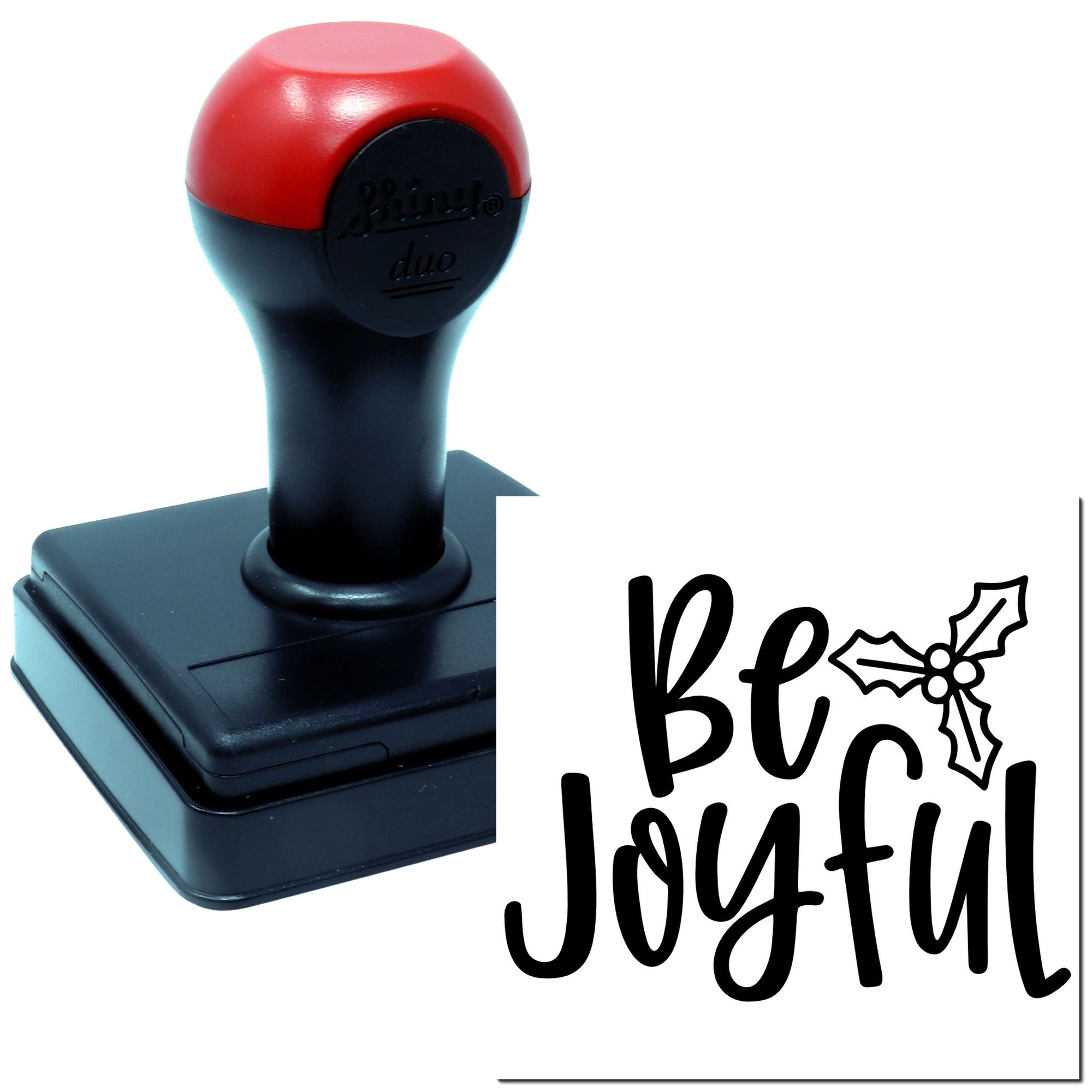 Self-inking rubber stamp with Be Joyful holiday greeting and holly design for cards, crafts, and gift packaging.