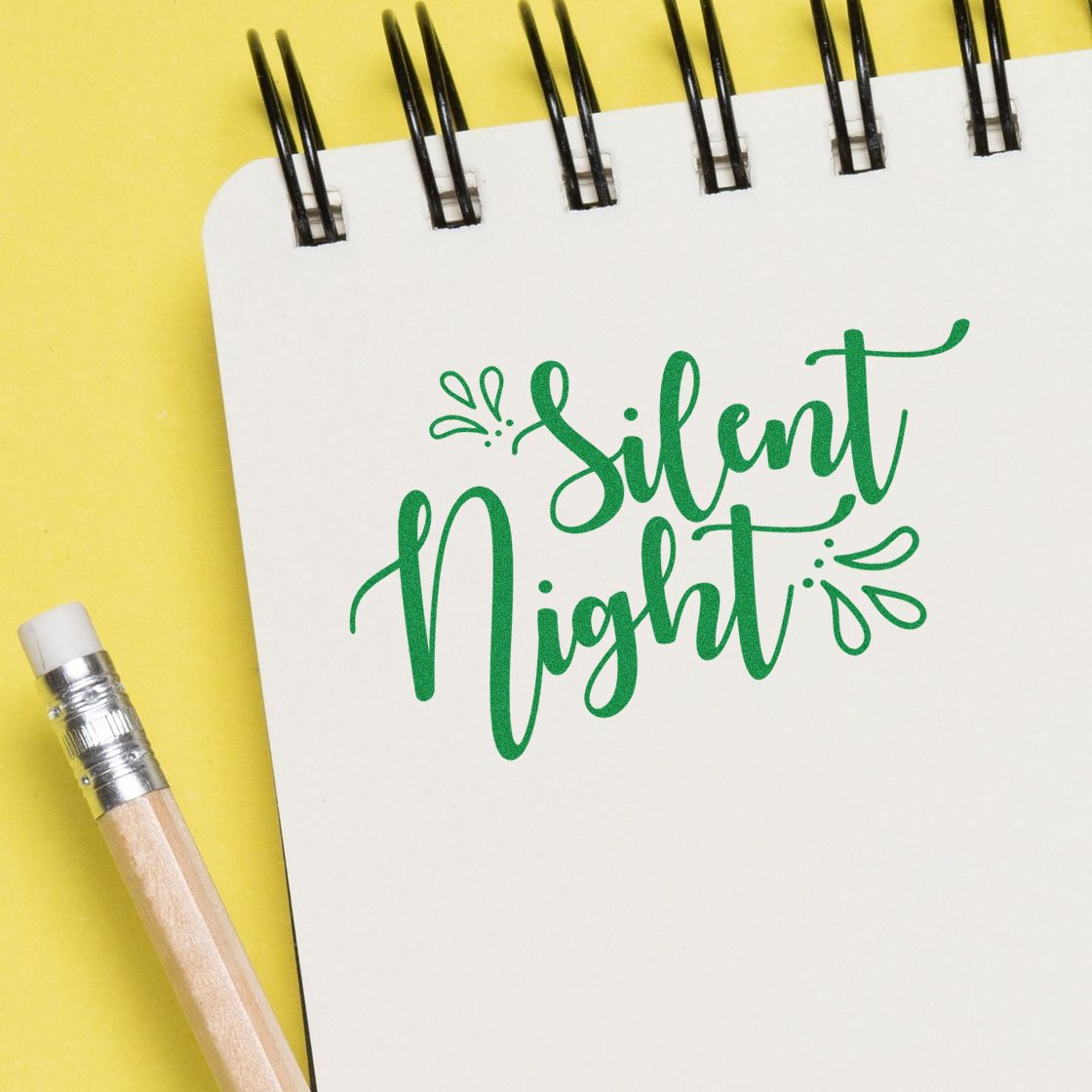 Green Silent Night rubber stamp design on notebook paper, ideal for Christmas card making and holiday crafts.