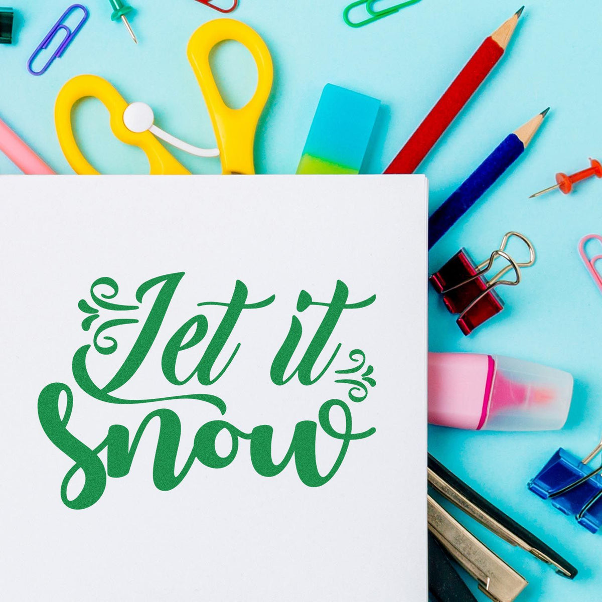 Let It Snow Decorative Script rubber stamp shown in green ink, stamped for projects such as matched album page.