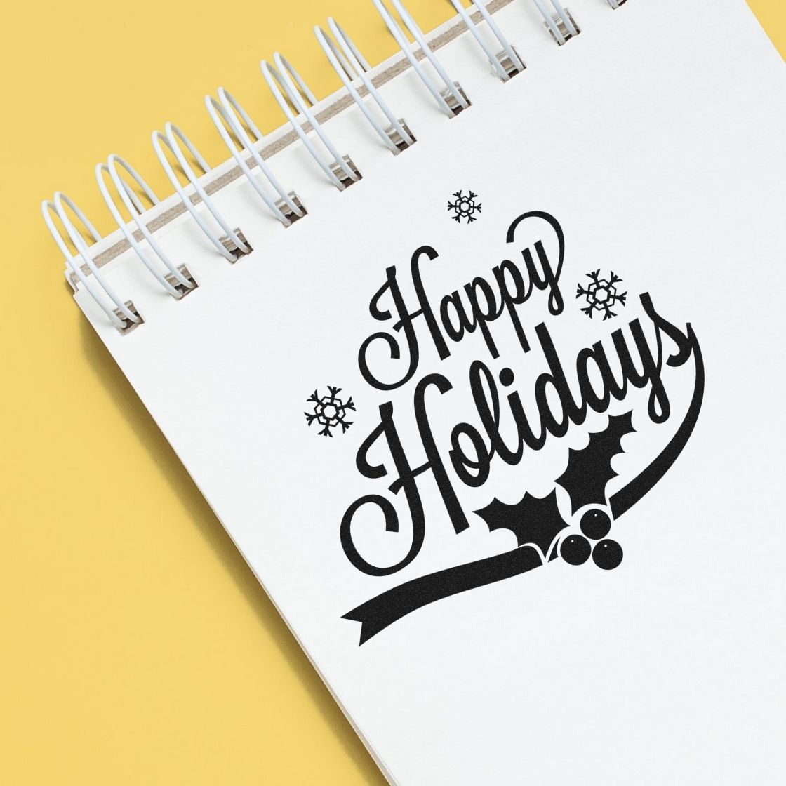 Holiday rubber stamp design with Happy Holidays message and snowflakes for seasonal cards, crafts, and gift packaging.