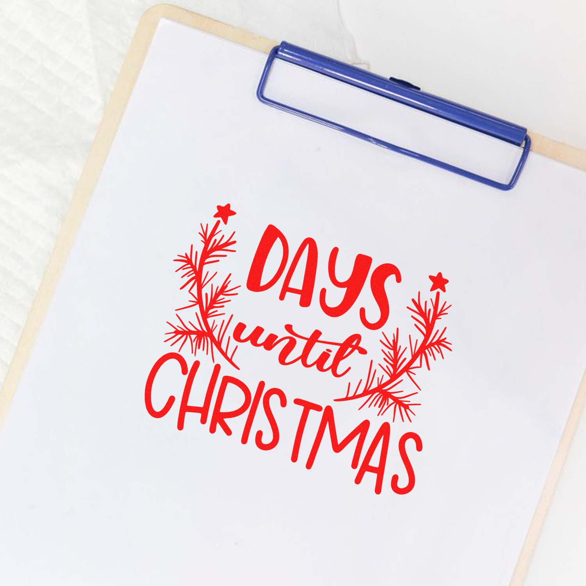 Christmas rubber stamp design showing a red Days Until Christmas holiday countdown on a clipboard