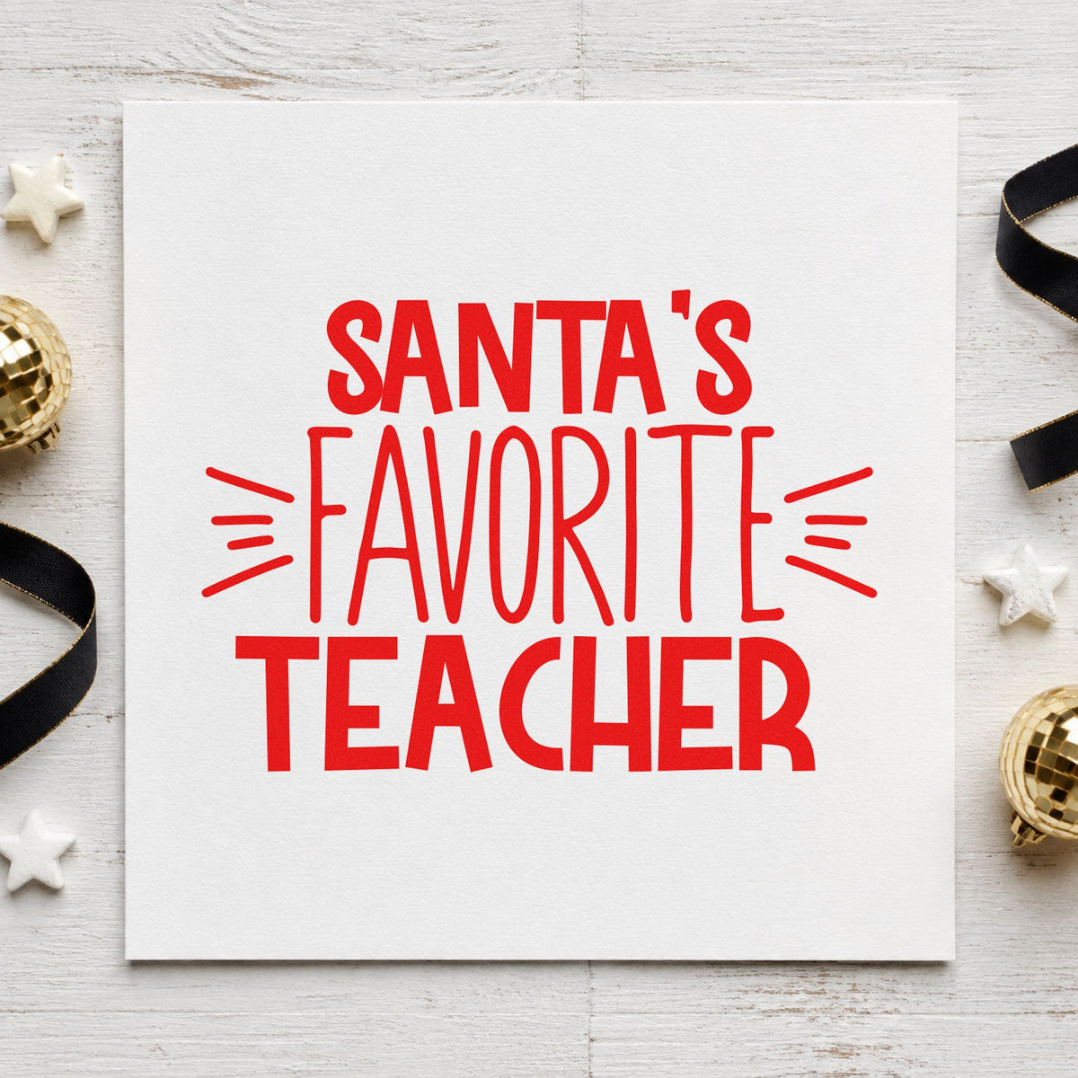 Santa's Favorite Teacher craft stamp in red ink on cardstock, an easy option for lanyard ribbon ink.