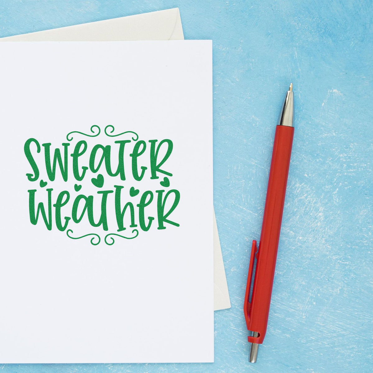 Sweater Weather Hearts rubber stamp shown in green ink, stamped for projects such as thrift haul album.