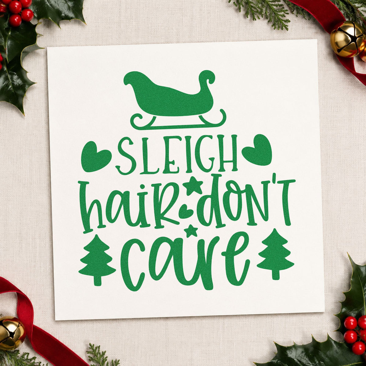 Sleigh Hair Don't Care craft stamp imprint in green ink on a handmade project, one idea being product bag tags.
