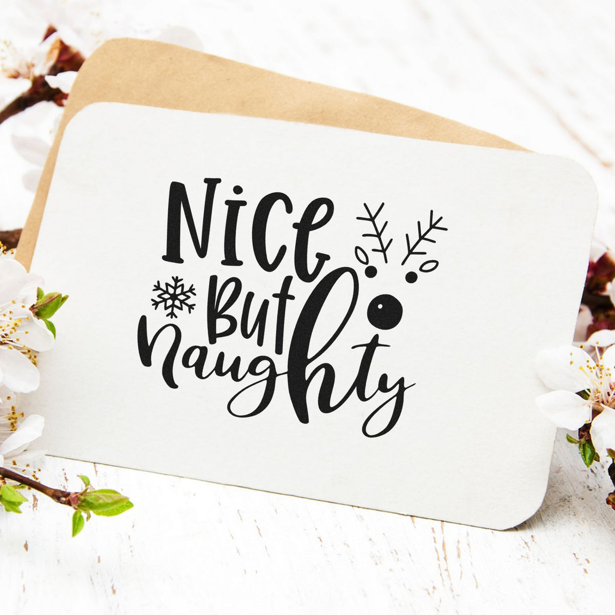 Nice but Naughty Christmas rubber stamp design for holiday cards, featuring playful snowflake accents.