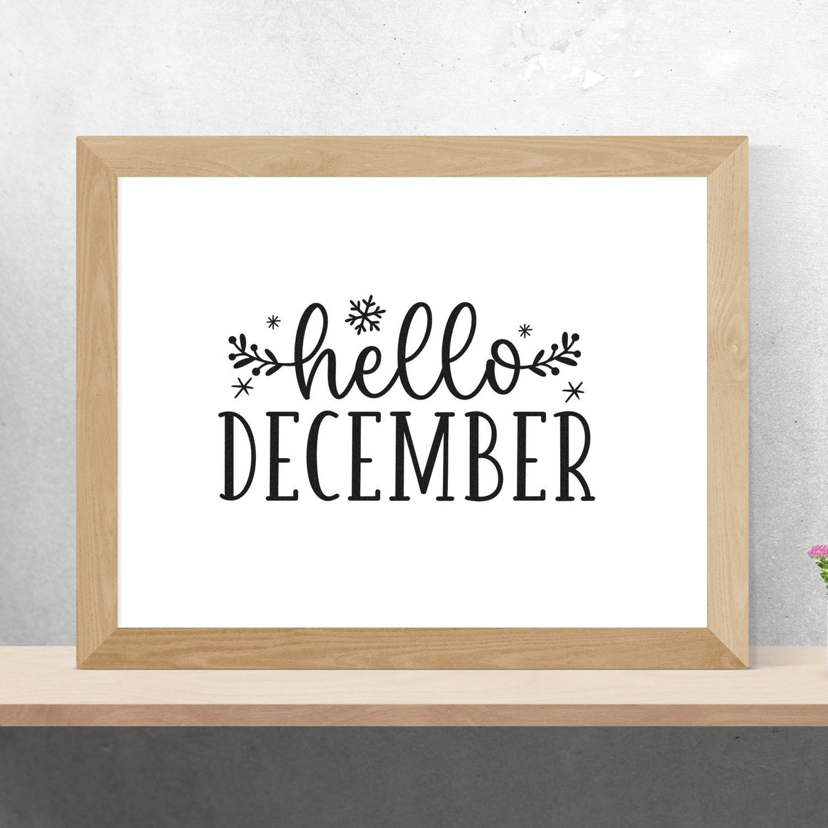 Hello December holiday rubber stamp design with script lettering, snowflakes, and festive branch accents.