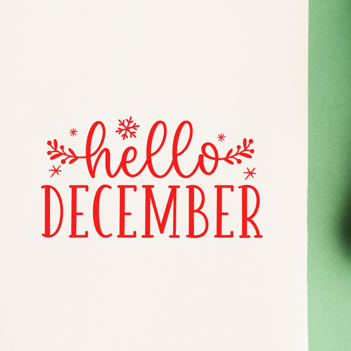 Red hello December holiday rubber stamp design with snowflakes and greenery for festive card making.