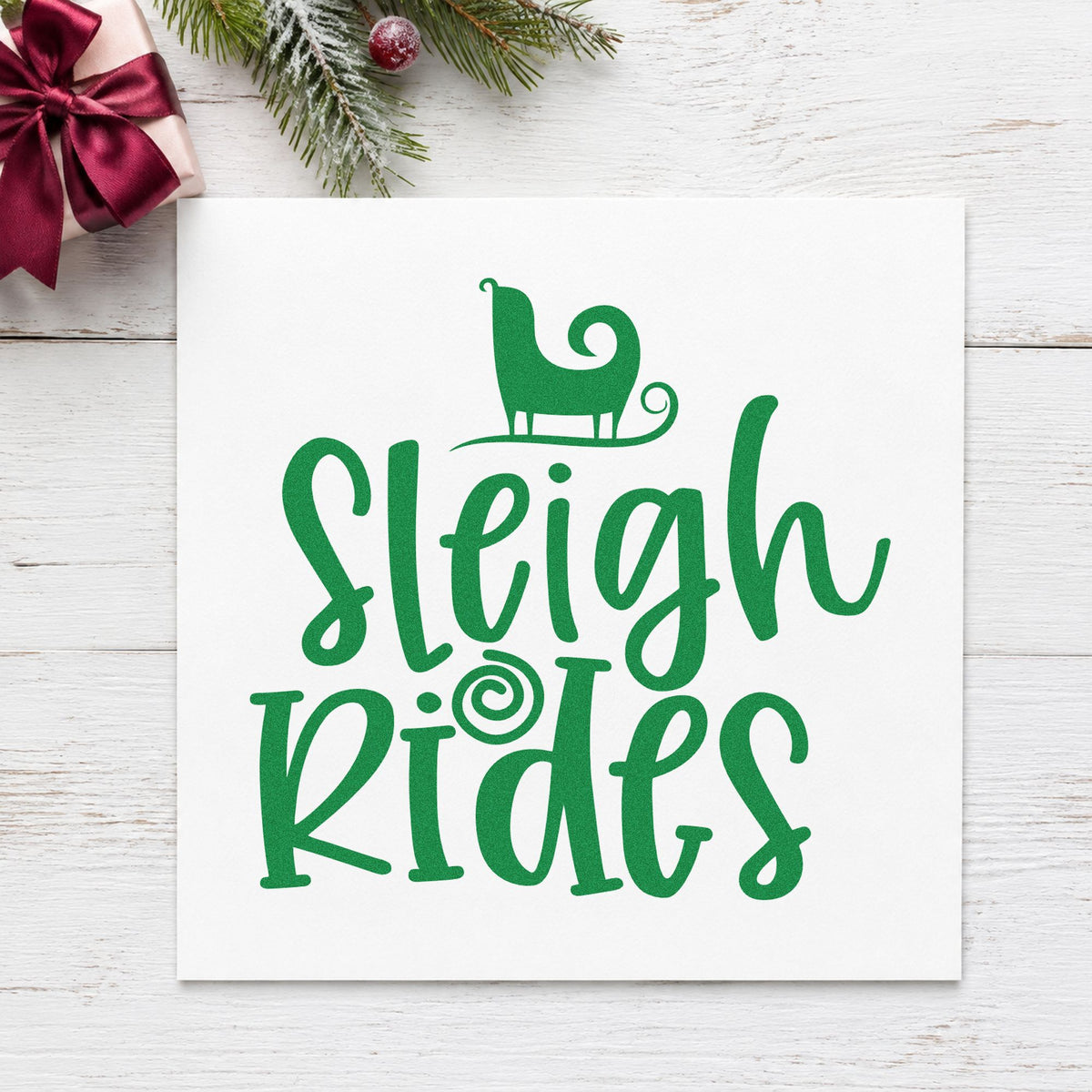 Sleigh Rides Silhouette craft stamp imprint in green ink on a handmade project, one idea being ride ticket cards.