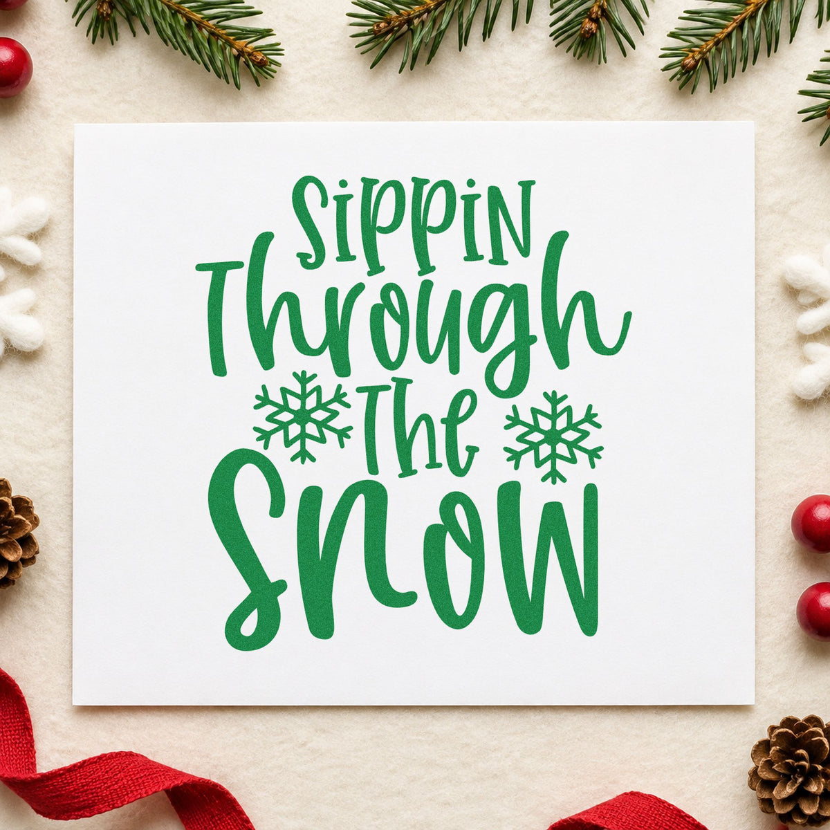 Sippin Through The Snow craft stamp imprint in green ink on a handmade project, one idea being sled hill placards.