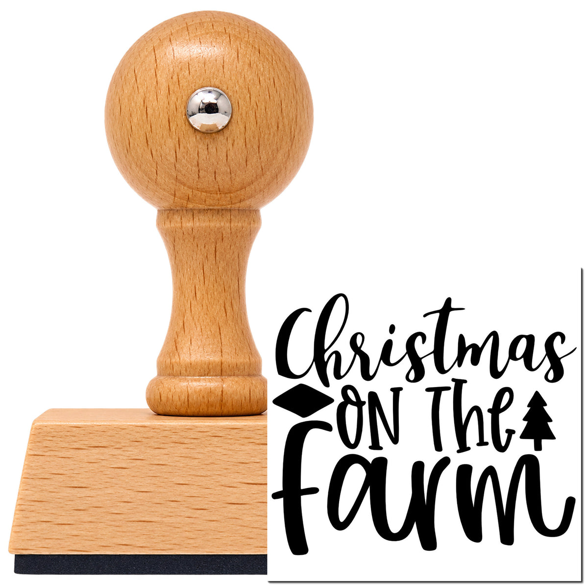 Christmas On The Farm Vintage Pro rubber stamp in European beech wood with a round knob handle, shown beside its black imprint.