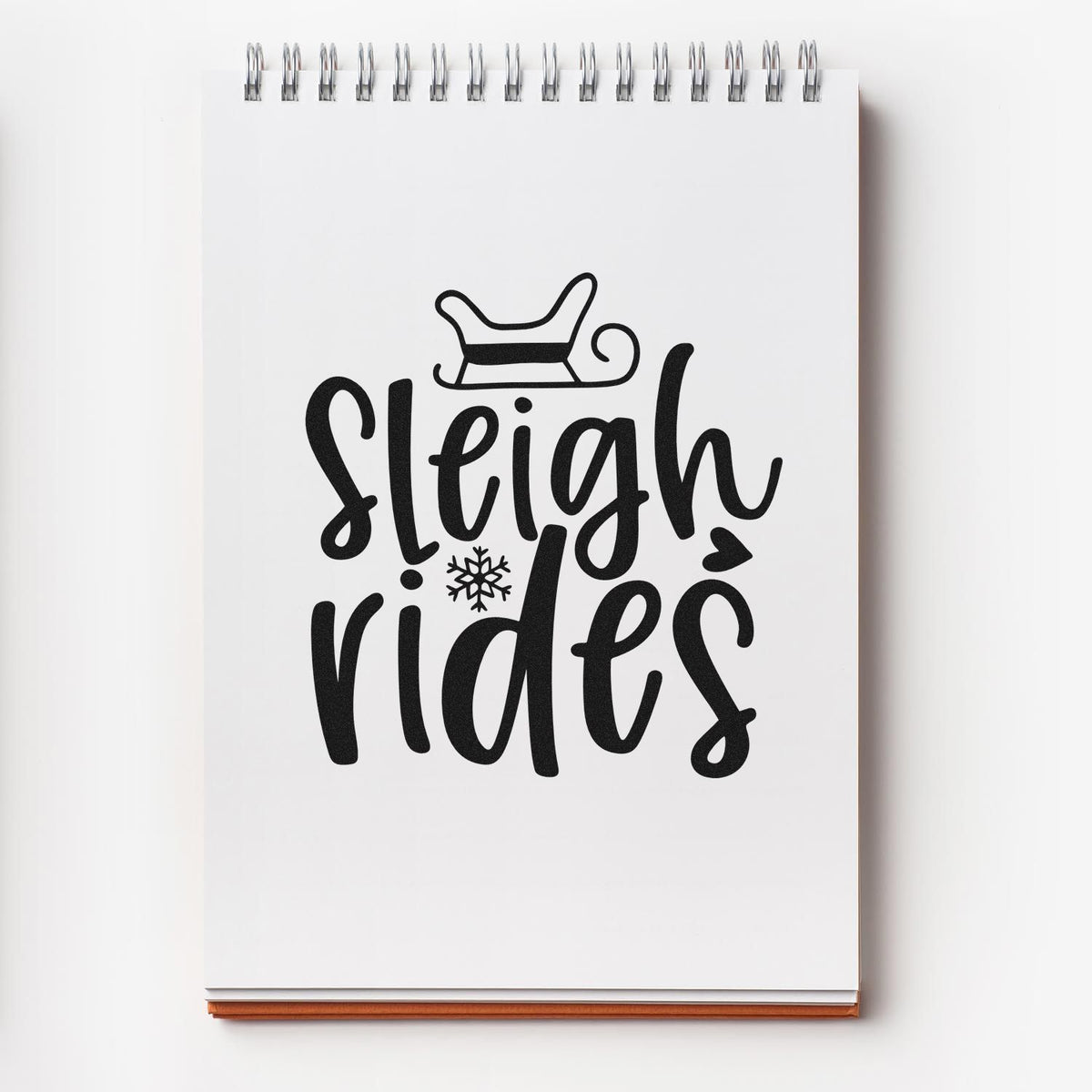Sleigh rides Christmas rubber stamp design with sleigh icon and snowflake for festive cards, scrapbooking, and holiday crafts.