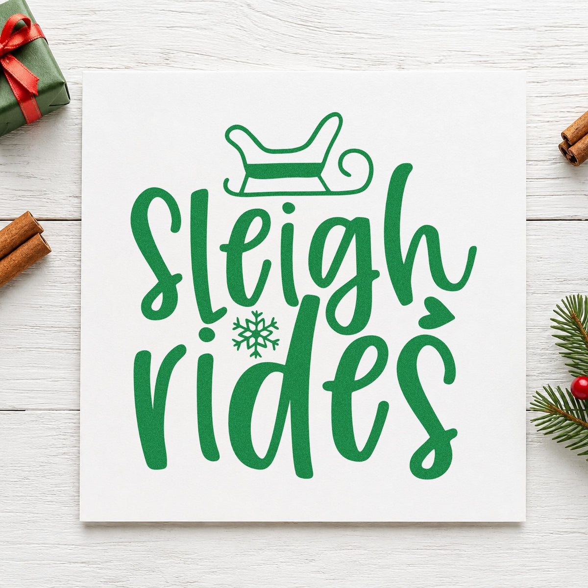 Sleigh Rides Winter Lettering craft stamp imprint in green ink on a handmade project, one idea being tour ticket cards.